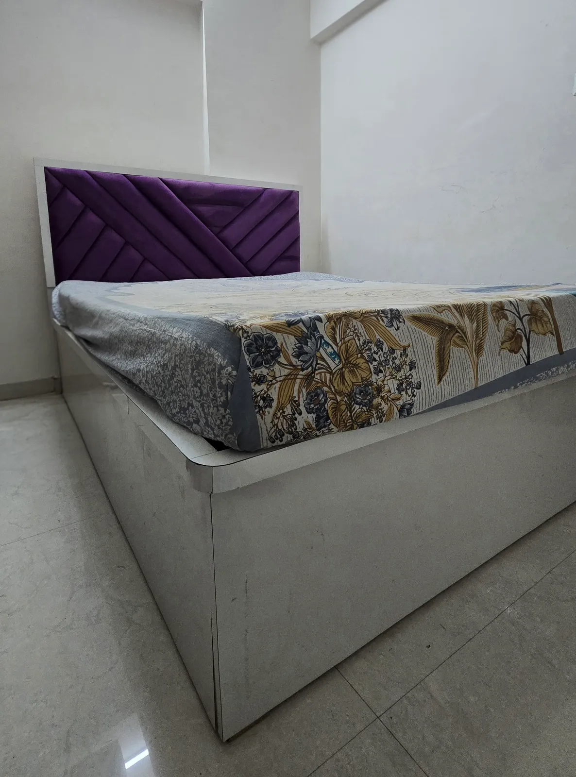 queen-size bed with a stylish purple upholstered headboard and a sturdy wooden base for sale in Pune, Maharashtra