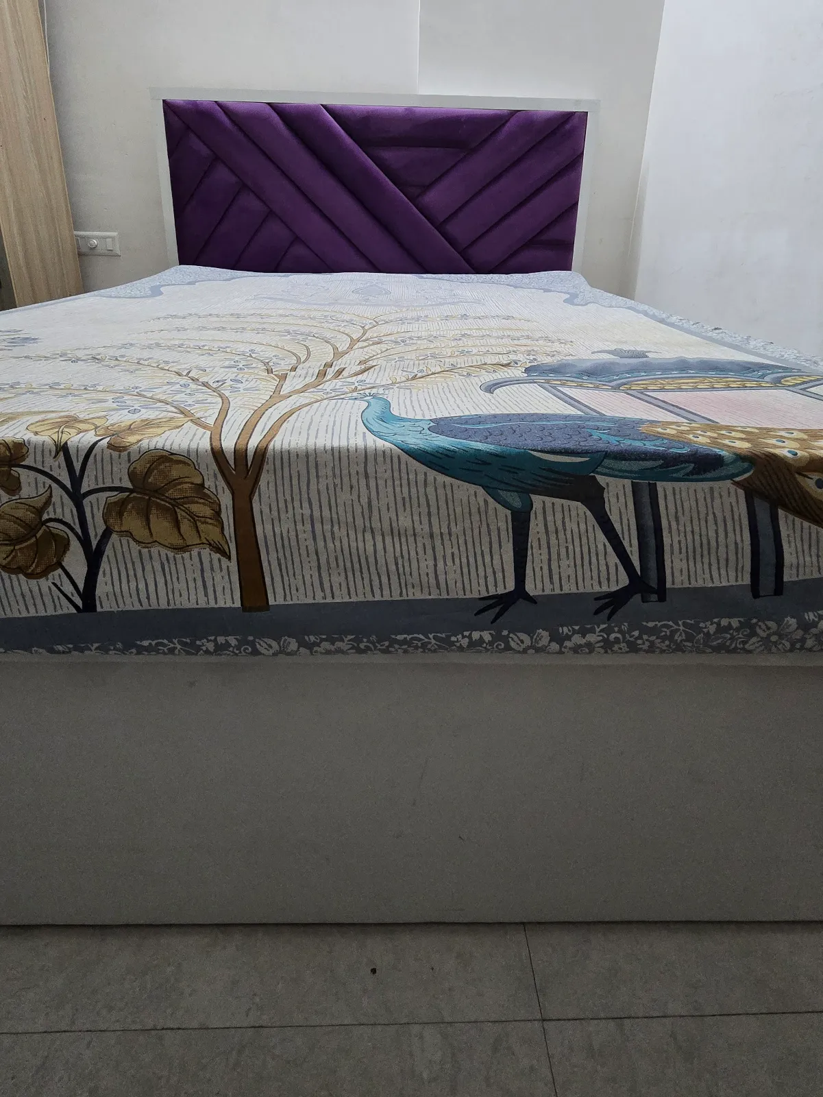 queen-size bed with a stylish purple upholstered headboard and a sturdy wooden base - Thumbnail 2